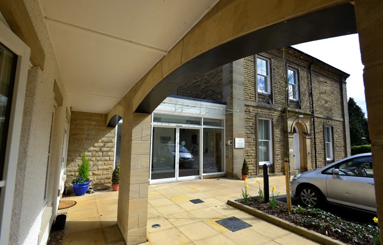 A view of the entrance under the archway at Woodlands