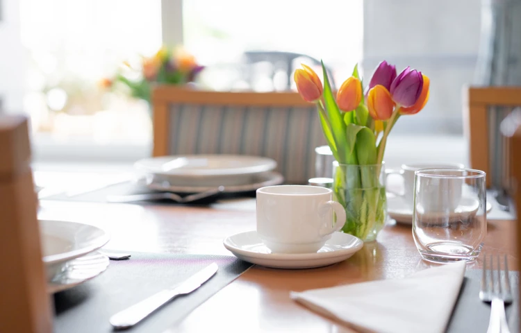 Fresh Tulips On The Dining Table At Abbeyfield House