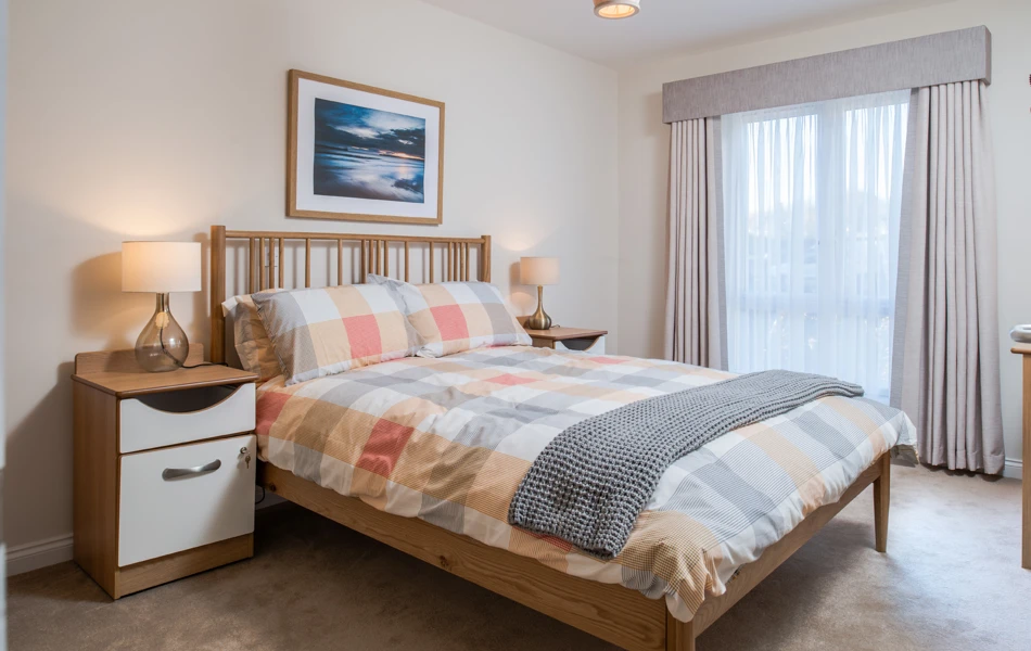 Residents large double bed with bed side tables and lamps at Hope Bank View, Sunderland