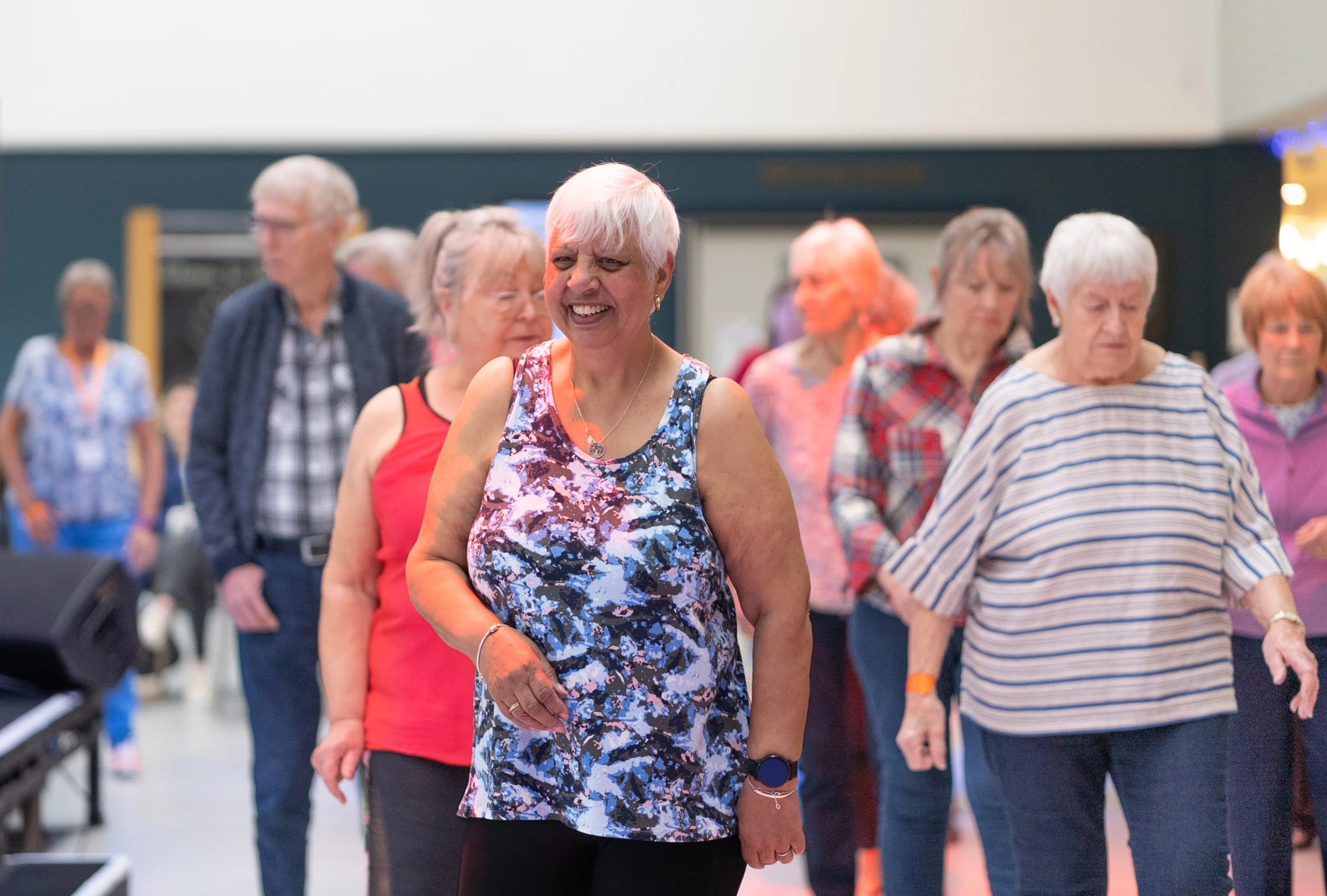 Group of older people taking part in an exercise class