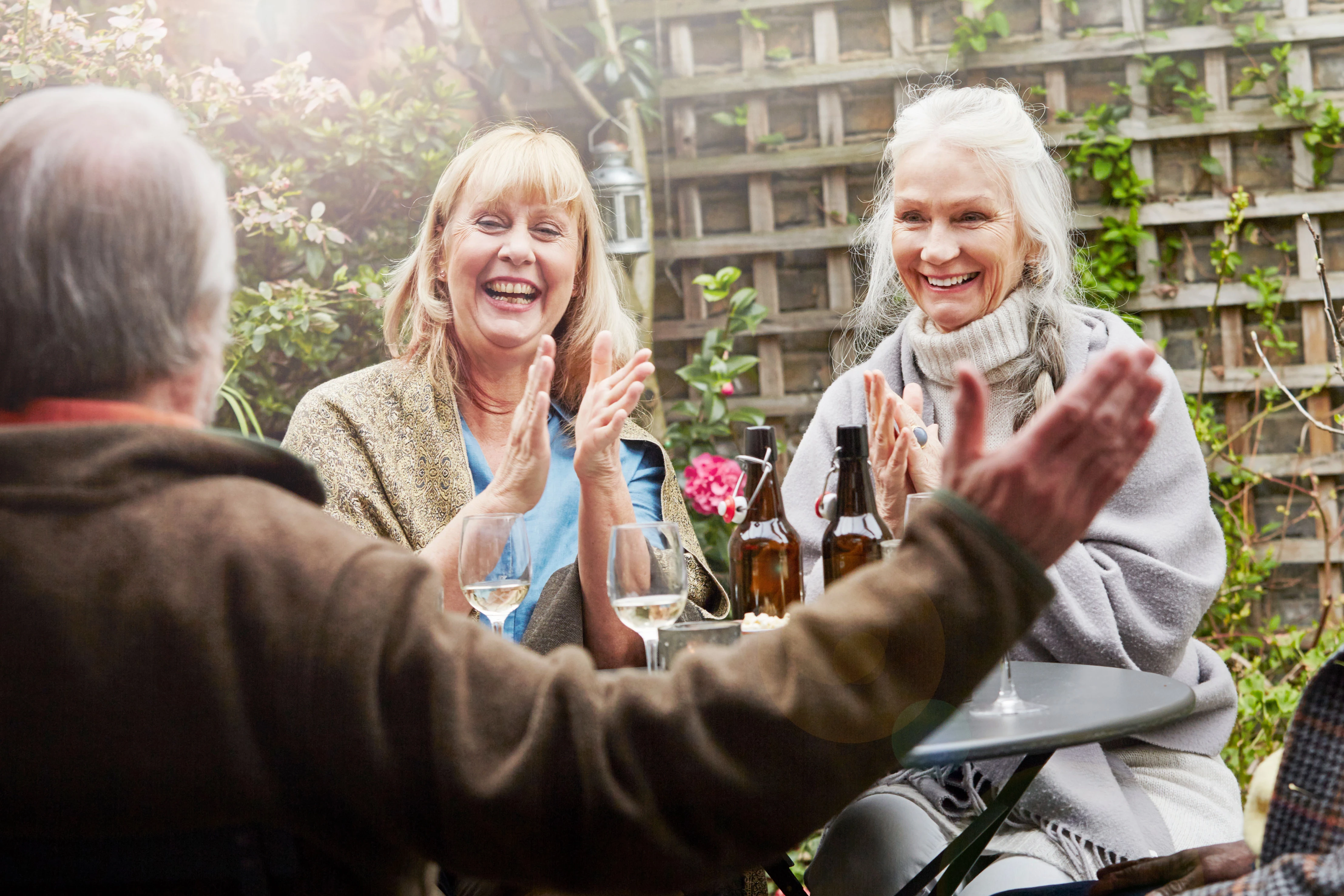 Group of happy older people sitting outdoors