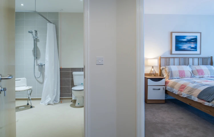 Bedroom and large bathroom with built in shower at Hope Bank View