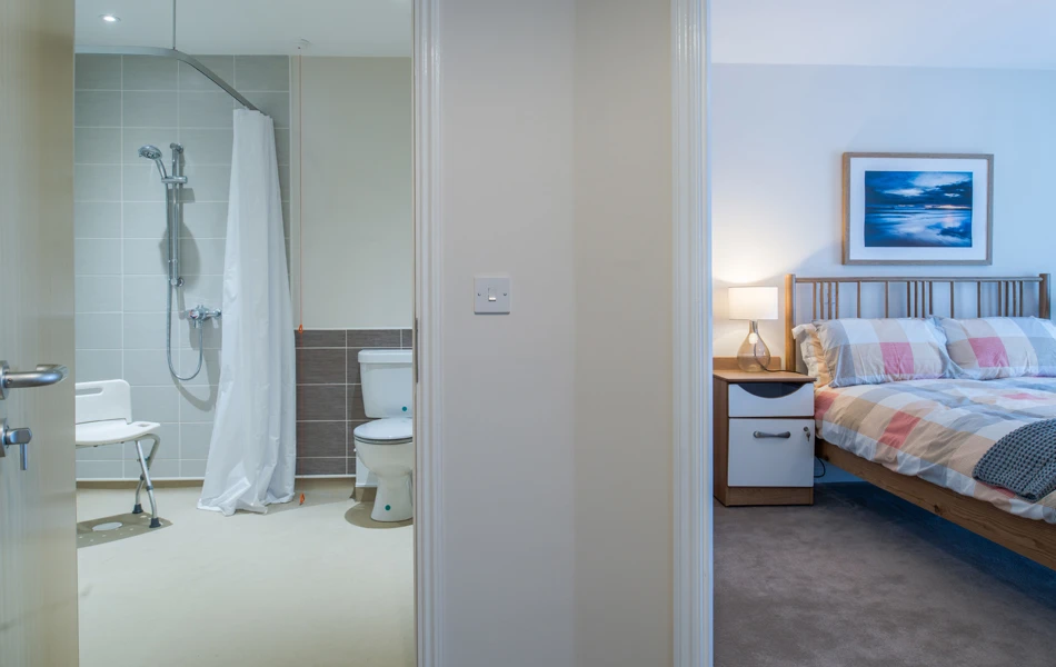 Bedroom and large bathroom with built in shower at Hope Bank View