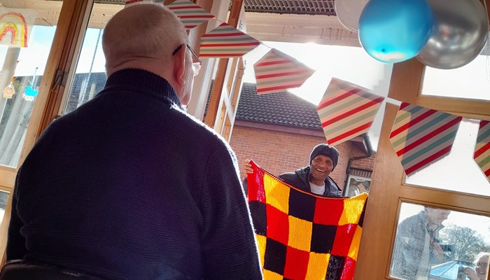 Watford legend surprises care home resident Des on his birthday Image